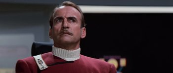 Movie still from “Star Trek III: The Search for Spock” (1984), directed by Leonard Nimoy – A person wearing a red shirt; Close Up shot, Low angle