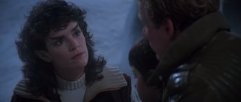 Movie still from “Star Trek III: The Search for Spock” (1984), directed by Leonard Nimoy – A young woman is sitting in front of two men; Close Up shot, Over the shoulder angle