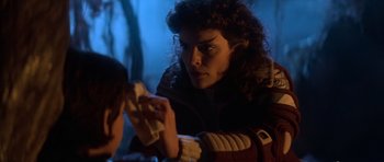 Movie still from “Star Trek III: The Search for Spock” (1984), directed by Leonard Nimoy – A woman is holding a cloth in her hand; Close Up shot, Over the shoulder angle