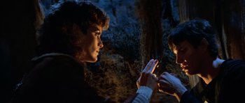 Movie still from “Star Trek III: The Search for Spock” (1984), directed by Leonard Nimoy – Two people are sitting in the dark near a tree; Close Up shot, Over the shoulder angle