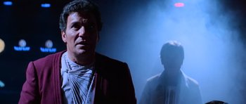 Movie still from “Star Trek III: The Search for Spock” (1984), directed by Leonard Nimoy – A man standing in a room with a light shining on him; Medium shot, Low angle