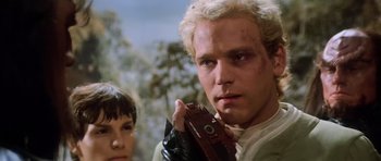 Movie still from “Star Trek III: The Search for Spock” (1984), directed by Leonard Nimoy – A man holding a camera while standing next to a woman; Close Up shot, Low angle