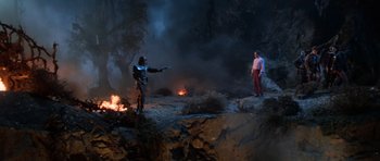 Movie still from “Star Trek III: The Search for Spock” (1984), directed by Leonard Nimoy – Two people standing on a cliff with a fire in the background; Wide shot, High angle
