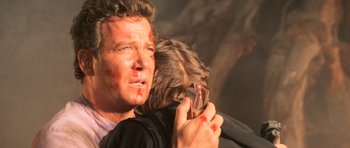 Movie still from “Star Trek III: The Search for Spock” (1984), directed by Leonard Nimoy – A man holding a cell phone in front of another man; Close Up shot, Over the shoulder angle