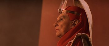 Movie still from “Star Trek III: The Search for Spock” (1984), directed by Leonard Nimoy – An older woman wearing a red outfit and a red hat; Close Up shot, Low angle