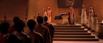 Movie still from “Star Trek III: The Search for Spock” (1984), directed by Leonard Nimoy – A group of people standing on steps in front of an audience; Wide shot, High angle