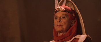 Movie still from “Star Trek III: The Search for Spock” (1984), directed by Leonard Nimoy – An older woman wearing a red hat and a red scarf; Close Up shot, Over the shoulder angle