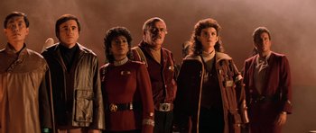 Movie still from “Star Trek III: The Search for Spock” (1984), directed by Leonard Nimoy – A group of people standing next to each other; Medium shot, Low angle