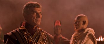 Movie still from “Star Trek III: The Search for Spock” (1984), directed by Leonard Nimoy – A man in a costume is standing next to another man in a costume; Close Up shot, Over the shoulder angle