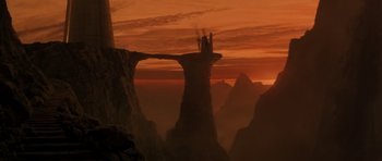 Movie still from “Star Trek III: The Search for Spock” (1984), directed by Leonard Nimoy – A view of a mountain range with a castle on top of it at sunset; Extreme Wide shot, High angle
