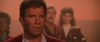 Movie still from “Star Trek III: The Search for Spock” (1984), directed by Leonard Nimoy – A person wearing a red shirt; Close Up shot, Over the shoulder angle