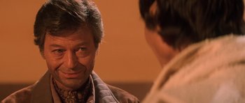 Movie still from “Star Trek III: The Search for Spock” (1984), directed by Leonard Nimoy – A man in a brown jacket talking to another man in a brown jacket; Close Up shot, Over the shoulder angle