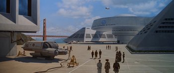 Movie still from “Star Trek IV: The Voyage Home” (1986), directed by Leonard Nimoy – An image of people standing on the ground near a plane; Extreme Wide shot, High angle