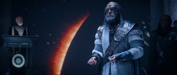 Movie still from “Star Trek IV: The Voyage Home” (1986), directed by Leonard Nimoy – An image of a man in a costume in front of a space background; Medium shot, Over the shoulder angle