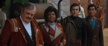 Movie still from “Star Trek IV: The Voyage Home” (1986), directed by Leonard Nimoy – A group of people standing next to each other; Medium shot, Over the shoulder angle