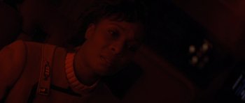 Movie still from “Star Trek IV: The Voyage Home” (1986), directed by Leonard Nimoy – A woman is looking at the camera in the dark; Close Up shot, Low angle