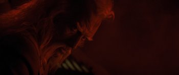 Movie still from “Star Trek IV: The Voyage Home” (1986), directed by Leonard Nimoy – A man with his head tilted to the side in a dark room; Close Up shot, Low angle