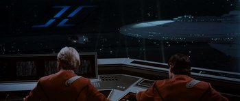 Movie still from “Star Trek IV: The Voyage Home” (1986), directed by Leonard Nimoy – Two people are sitting in front of a computer screen; Extreme Wide shot, Low angle