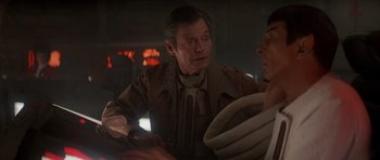 Movie still from “Star Trek IV: The Voyage Home” (1986), directed by Leonard Nimoy – A man in a brown jacket and a man in a white shirt; Close Up shot, Over the shoulder angle