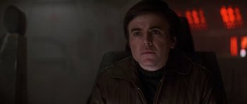 Movie still from “Star Trek IV: The Voyage Home” (1986), directed by Leonard Nimoy – A man sitting in a chair looking at the camera; Close Up shot, Low angle