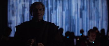 Movie still from “Star Trek IV: The Voyage Home” (1986), directed by Leonard Nimoy – A star wars character in front of a blue background; Close Up shot, Low angle