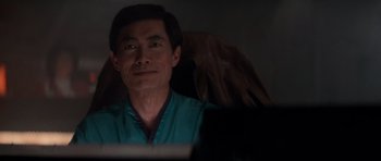 Movie still from “Star Trek IV: The Voyage Home” (1986), directed by Leonard Nimoy – A man sitting in front of a computer monitor; Close Up shot, Over the shoulder angle