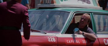 Movie still from “Star Trek IV: The Voyage Home” (1986), directed by Leonard Nimoy – A taxi cab is parked on the side of the road; Close Up shot, Low angle