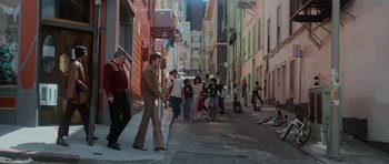 Movie still from “Star Trek IV: The Voyage Home” (1986), directed by Leonard Nimoy – A group of people walking down a street; Wide shot, High angle