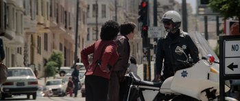 Movie still from “Star Trek IV: The Voyage Home” (1986), directed by Leonard Nimoy – A man and a woman standing next to each other on the side of the street; Wide shot, Over the shoulder angle