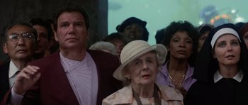 Movie still from “Star Trek IV: The Voyage Home” (1986), directed by Leonard Nimoy – A group of people standing in a room; Medium shot, Low angle
