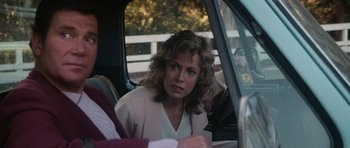 Movie still from “Star Trek IV: The Voyage Home” (1986), directed by Leonard Nimoy – A woman sitting in the back seat of a car; Close Up shot, Over the shoulder angle