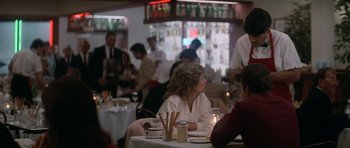 Movie still from “Star Trek IV: The Voyage Home” (1986), directed by Leonard Nimoy – A group of people sitting at a table in a restaurant; Medium shot, Over the shoulder angle