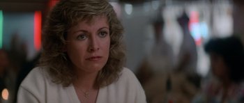 Movie still from “Star Trek IV: The Voyage Home” (1986), directed by Leonard Nimoy – A person wearing a white shirt; Close Up shot, Over the shoulder angle