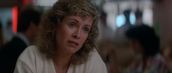 Movie still from “Star Trek IV: The Voyage Home” (1986), directed by Leonard Nimoy – A person sitting in a room; Close Up shot, Low angle