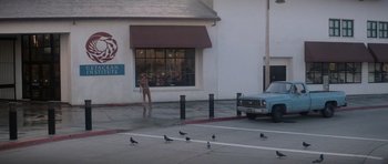 Movie still from “Star Trek IV: The Voyage Home” (1986), directed by Leonard Nimoy – A group of birds on the ground near a building; Extreme Wide shot, High angle