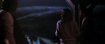 Movie still from “Star Trek IV: The Voyage Home” (1986), directed by Leonard Nimoy – A woman standing in front of a large whale; Medium shot, Over the shoulder angle