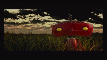 Movie still from “Star Trek Into Darkness” (2013), directed by J.J. Abrams – A red robot in a grassy field under a cloudy sky; Extreme Wide shot, Low angle