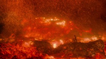 Movie still from “Star Trek Into Darkness” (2013), directed by J.J. Abrams – A man standing on top of a hill in front of a fire; Extreme Wide shot, High angle