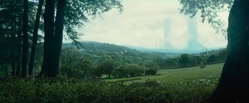 Movie still from “Star Trek Into Darkness” (2013), directed by J.J. Abrams – A view of trees and a city skyline in the distance; Extreme Wide shot, High angle