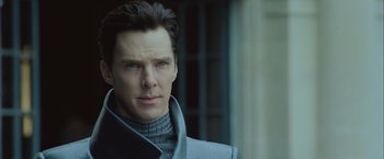 Movie still from “Star Trek Into Darkness” (2013), directed by J.J. Abrams – A man in a gray jacket is looking straight ahead; Close Up shot, Over the shoulder angle