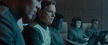 Movie still from “Star Trek Into Darkness” (2013), directed by J.J. Abrams – A group of people sitting next to each other on a table; Close Up shot, Over the shoulder angle