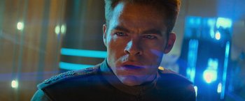 Movie still from “Star Trek Into Darkness” (2013), directed by J.J. Abrams – A man's face in a dark room; Close Up shot, Over the shoulder angle