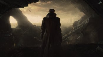 Movie still from “Star Trek Into Darkness” (2013), directed by J.J. Abrams – A man in a trench coat standing in front of a cave; Wide shot, Low angle
