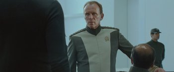Movie still from “Star Trek Into Darkness” (2013), directed by J.J. Abrams – A man in a uniform looking at himself in the mirror; Close Up shot, Over the shoulder angle