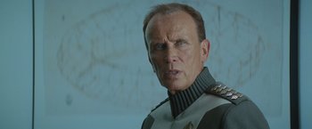 Movie still from “Star Trek Into Darkness” (2013), directed by J.J. Abrams – An older man wearing a uniform and a star trek uniform; Close Up shot, Low angle