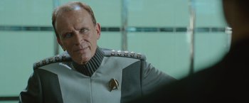 Movie still from “Star Trek Into Darkness” (2013), directed by J.J. Abrams – An older man in a star trek uniform; Close Up shot, Over the shoulder angle