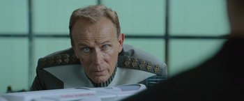 Movie still from “Star Trek Into Darkness” (2013), directed by J.J. Abrams – An older man wearing a uniform looking at a computer screen; Close Up shot, Over the shoulder angle