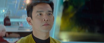 Movie still from “Star Trek Into Darkness” (2013), directed by J.J. Abrams – A person wearing a yellow shirt; Close Up shot, Over the shoulder angle