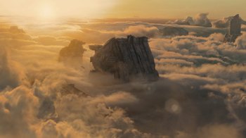 Movie still from “Star Trek Into Darkness” (2013), directed by J.J. Abrams – A mountain in the middle of a cloud filled sky; Extreme Wide shot, Low angle