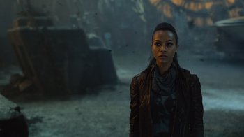 Movie still from “Star Trek Into Darkness” (2013), directed by J.J. Abrams – A woman standing in the middle of a field; Close Up shot, Over the shoulder angle